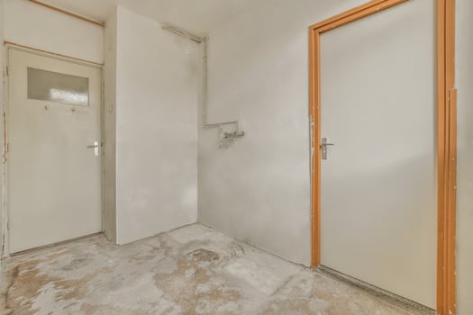 An empty bathroom with a toilet and shower photo