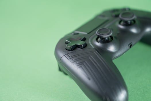 A close up of a black game controller photo
