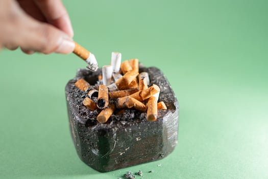 Cigarette Ashtray with Used Butts photo