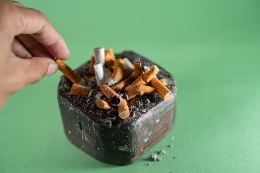 Cigarette Ashtray with Used Butts photo