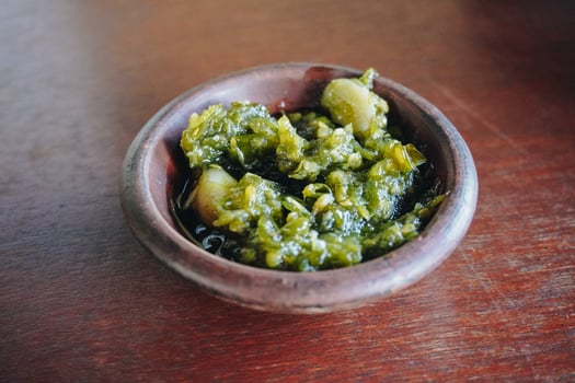 Sambal Ijo or Indonesian spicy green chili sauce made with onion, green chilies, garlic, and salt. photo