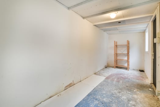 A room with a ladder and a shelf in it photo