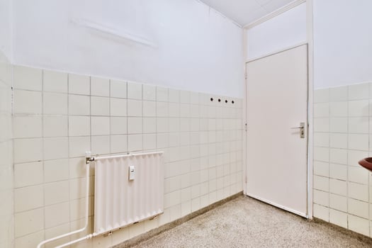 A bathroom with a sink, toilet and a radiator photo