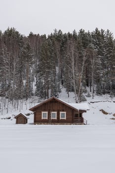 Winter holiday house in forest. photo