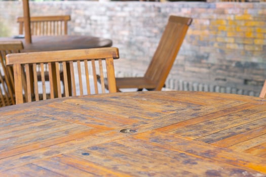 Empty wooden chairs and tables in restaurant outdoor photo