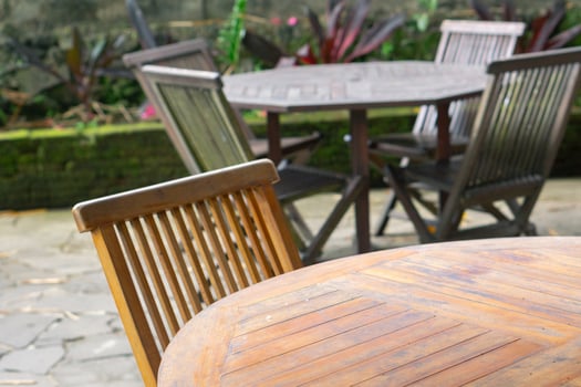 Empty wooden chairs and tables in restaurant outdoor photo