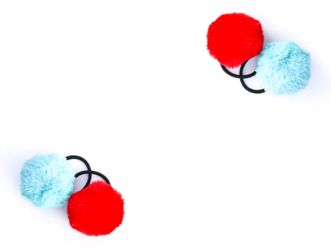 Colorful fluffy pompons on white background. Fashion decoration festive template. photo