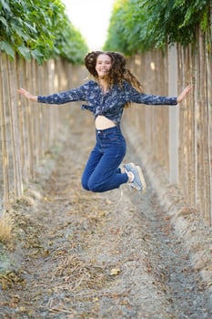 Experience the Joyful Jump in the Vineyard A Celebration of Nature and True Freedom photo