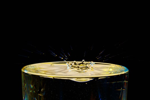 macro Beautiful drops in flight, colored drops photo