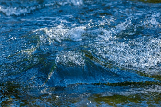 flow of water and spray from a stone photo