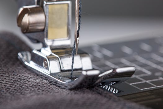 Sewing machine, stitching fabrics, needle in a round plan photo