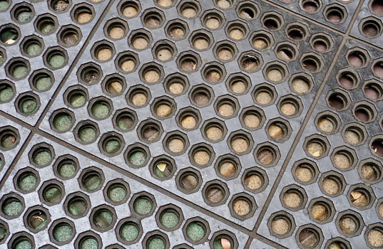 Anti slip rubber floor mat with round holes pattern isolated on horizontal ratio background. photo