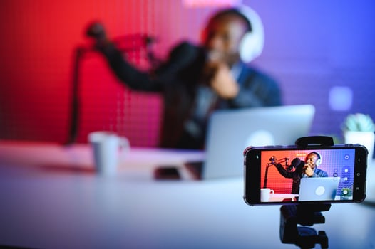 Black male influencer creates material for his internet audience, discussing new trends photo