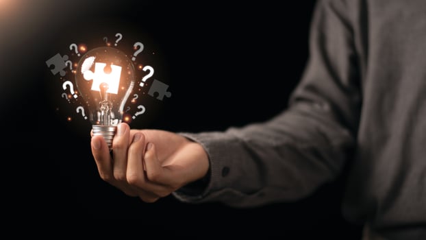 solution concept and demonstrating leadership strategies ,ideas ,thought process ,innovation and brain power from brainstorming ,A light bulb representing the power of thought in the human hand photo