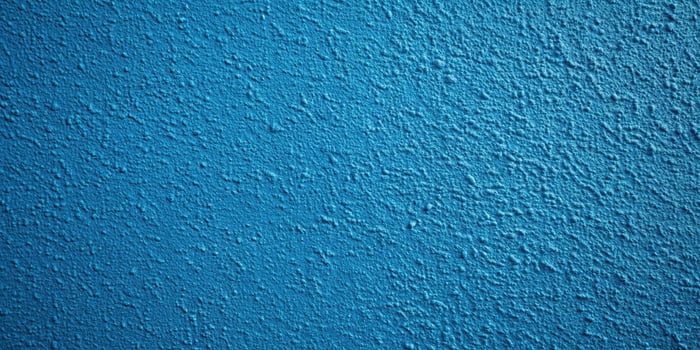 A blue wall with a white paint on it photo