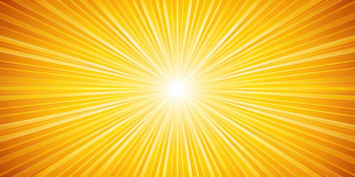 A bright yellow sun burst background with rays photo