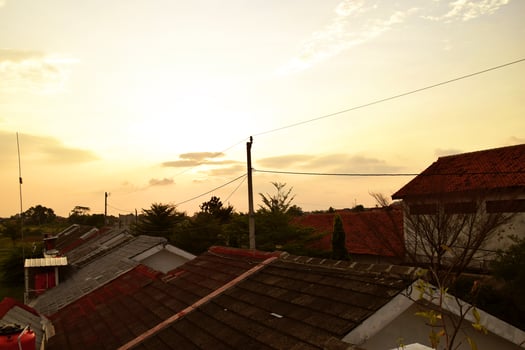 The atmosphere in the afternoon on the roof top of the house with the warm sky photo