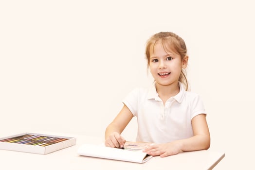 Child creativity with colored pencils. young artist engaged in drawing and creative expression photo