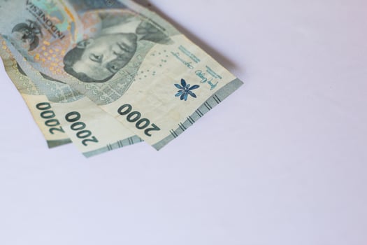 Indonesian money 2000 rupiah in close up photo from top corner