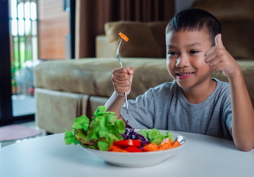 Children like to eat vegetables, Little cute boy eat healthy vegetables, Nutrition healthy eating habits for kids concept, Mixed color vegetables. photo