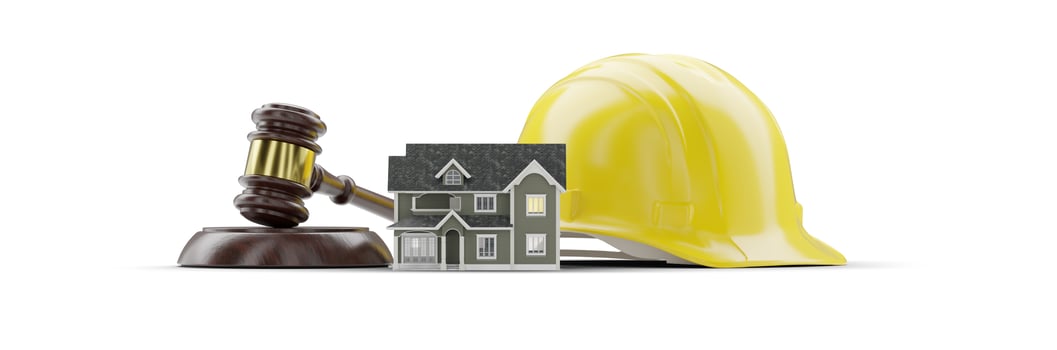 Miniature Model House, Yellow Hard Hat and Gavel Isolated on a White Background. photo