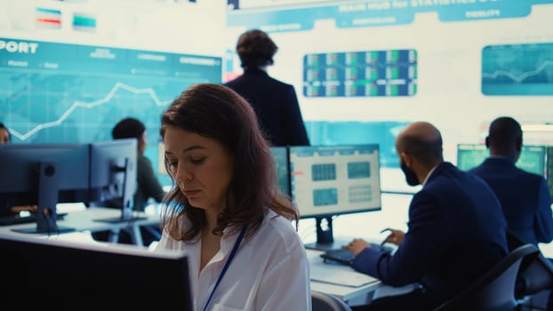 Company analyst reviewing infographics progress and success to help with achieving strategic objectives in a competitive business environment. Employee improving the workflow. Camera B. photo
