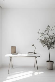 Minimalist office space with white walls, a sleek desk, and minimal decor to maintain focus and productivity photo