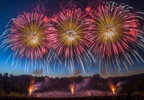 Colorful fireworks lighting up the sky with large bursts, silhouetting a cheering crowd below photo