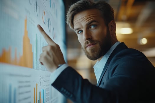 Professional man analyzing business data in modern office photo