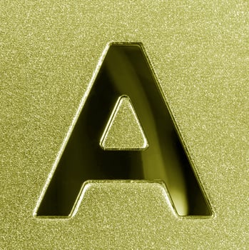 Letter A on a golden grained shiny metal surface. English alphabet. photo