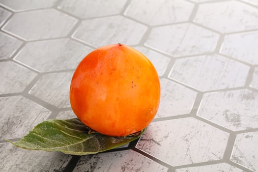 Fresh ripe sweet juicy persimmon photo