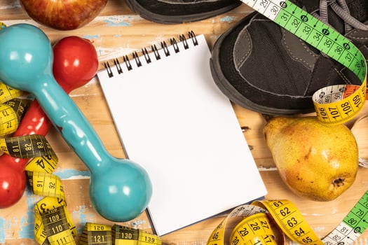 fruit for weight loss with measuring tape and equipment for exercise and diet, weight loss photo