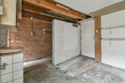 A bathroom with a sink and a brick wall photo