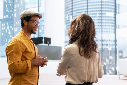 Corporate client and agent reviewing office space blueprints, negotiating a leasing contract agreement. Realtor providing legal assistance and insurance upon property investment deal. photo