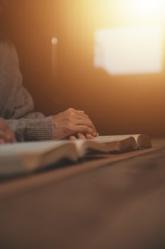 Christian group are praying to god with the bible and sharing the gospel. Concept of faith for god. photo