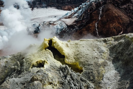 View of mountains and volcanoes from the edge of the crater photo