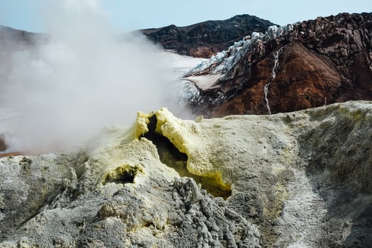 View of mountains and volcanoes from the edge of the crater photo