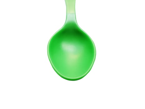 Green Spoon isolated on white background photo