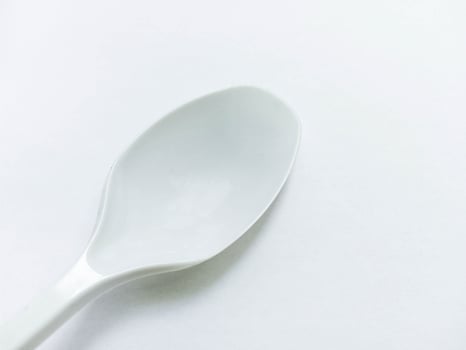 White Spoon closeup view isolated on white background photo