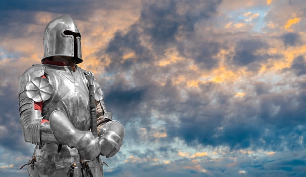 Knight in helmet and metal armor. photo