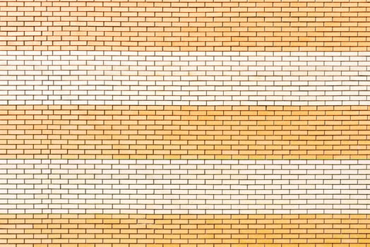 Yellow brick wall. Facade of an old building. Architectural background. photo