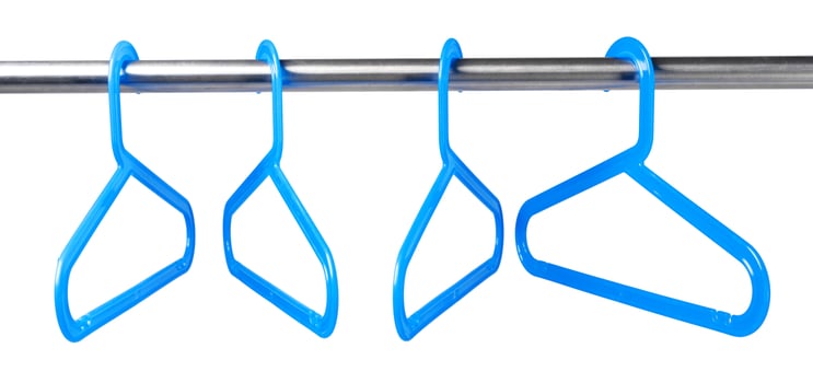 Metal rack with clothes hangers on white background photo