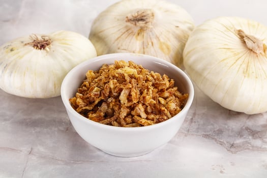 Dried roasted onion flakes for culinary photo
