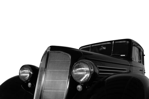 Vintage, black, shiny car on white background. photo