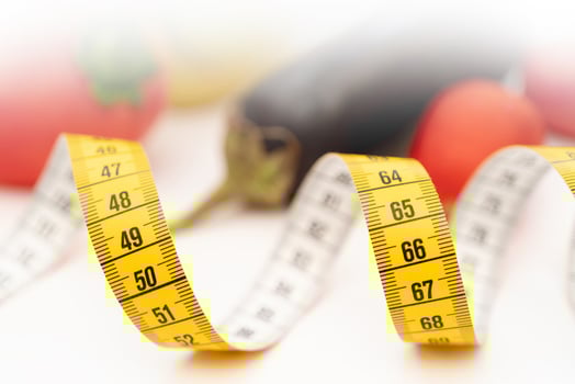 Yellow measuring tape. Fresh vegetables for healthy lifestyle diet food. photo