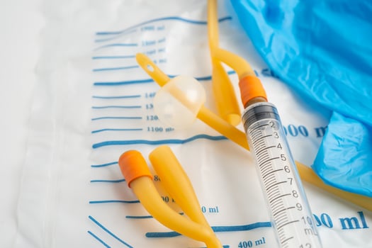 Foley urinary catheter with urine bag for disability or patient in hospital. photo