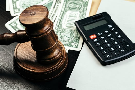 Business finance, corruption concept. Wooden gavel with american dollars photo