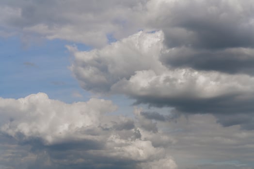 Beautiful white clouds on a bright blue background. photo