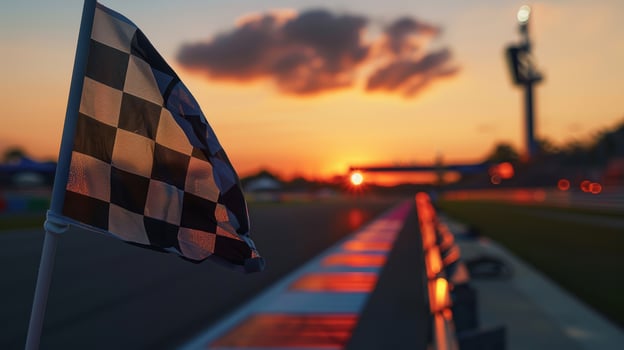 A checkered flag on the track at sunset photo