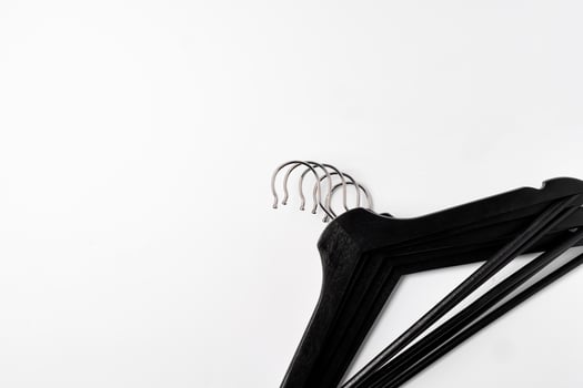 a pile clothes hangers on isolated white background photo